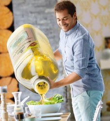 Guy pouring olive oil on the salad meme template