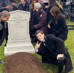 Guy posing in front of grave meme template