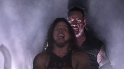 Undertaker teleports behind AJ Styles meme template
